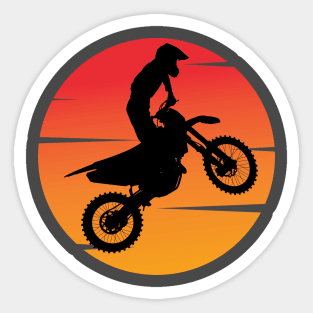 motocross silhouette jumping in front of the afternoon sun Sticker